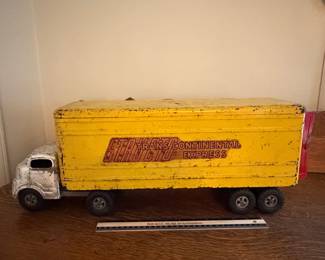 A213 - $60. Structo 1950’s Truck. Measures 22.5 inches long. It has many scratches throughout the body of the truck. Still moves well.