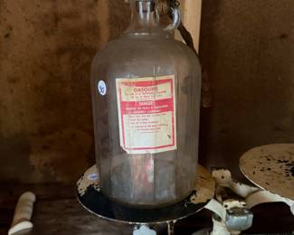 A229 - $30. 1 Gallon Glass Gasoline Bottle with wooden cork.