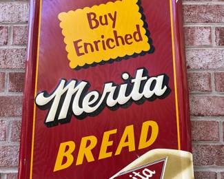 A64 - $1750. Merita Bread sign. Measures 54” by 18”. Bottom Right reads Stout Sign Co. St. Louis MO.