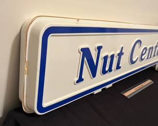 A192 - $125. 1980s Mr. Peanut Nut Center - Double sided hard plastic sign. Measures 49" x 13".