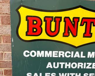A63 - $100. Bunton Commercial Mowers Double-sided sign. Measures 36” x 24”.
