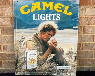 A3 - $40. Camel lights metal display sign from 1983. Measures 17.5“ x 21.5. It has a few small scratches, but otherwise in good, vintage shape.
