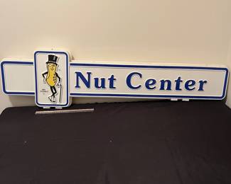 A192 - $125. 1980s Mr. Peanut Nut Center - Double sided hard plastic sign. Measures 49" x 13".