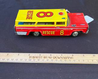 A102 - $50. Tin #8 Rescue Automobile.