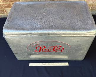 A105 - $125. 1950s Pepsi-Cola cooler. Measures 22“ x 13“.