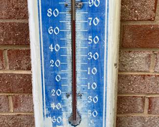 A60 - $35. Packard Vintage Thermometer. The thermometer works. Measure measures 8“ x 39“. Heavy fading.