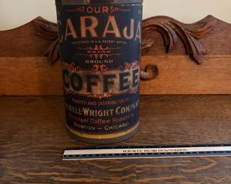 A204 - $40. Caraja Coffee Can. Measures 9.5 inches tall. Some rips on the paper label.