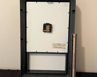 A133 - $30. 1989. Enjoy Coca-Cola wall clock. Measures 13" x 21.5" tall. Needs battery. Face has some scuffs.