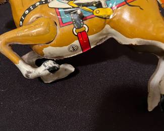 A170 - $50. 1930s MARX 10 wind up cowboy. Missing arm. Not working.