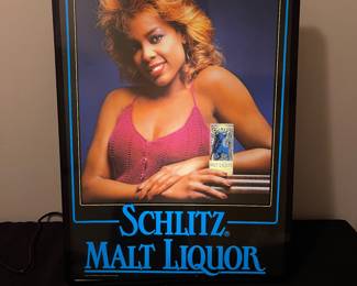 A144 - $180. 1985 Schlitz Malt Liquor Lighted Pub Bar Sign with African American Woman. Excellent condition. Works great. Measures 15.5" x 20.5" tall.