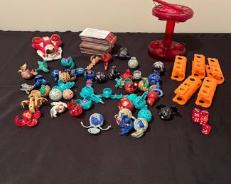 A227 - $150. Bakugan LOT with pieces & a box of cards.