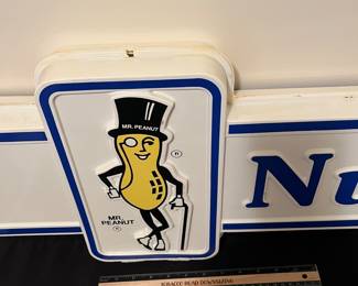 A192 - $125. 1980s Mr. Peanut Nut Center - Double sided hard plastic sign. Measures 49" x 13".