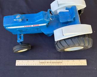 A97 - $50. Ford 8000 Tractor Toy. Measures 12“ x 8“. In good shape.