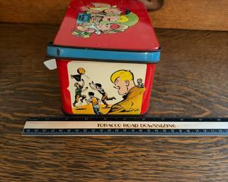 A228 - $20. Joe Palooka lunch kit. Measures 7“ x 5“ 4 inches tall. Has paint wear and scratches on the inside. Overall good, used shape.