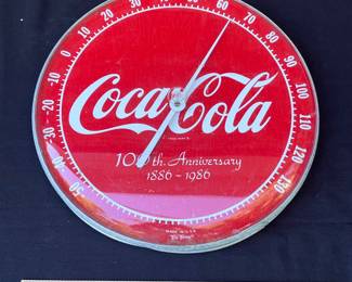 A66 - $30. 100th Anniversary Coca-Cola thermometer. Measures 12” diameter.