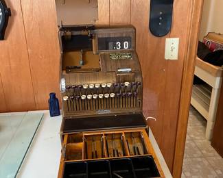 A177 - $100. 1950s Woodgrain Cash Register. Model 126(2). We have the key and the drawer opens.