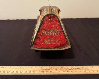 A171 - $150. 1931 Metalcraft Bottle Truck. Metal Wheels with 10 small glass bottles.