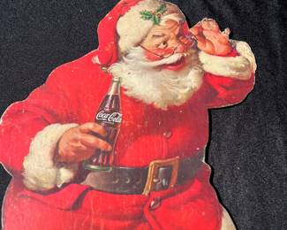 A41 - $80. 1960s stand-up Coca-Cola Santa. Measures 13" x 19.75". Some bent and ripped fingers.