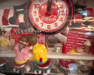 A214 - $40. Coca-Cola clock. box measures 22 x 15. In good shape, still in box. A few paint imperfections.