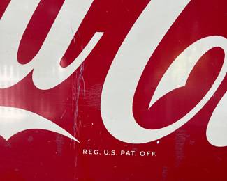 A24 - $700. Coca-Cola Robertson metal 1940s-1950s sign. Measures 54” x 18”.