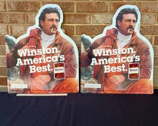 A14 - $25 each. Winston cigarettes, metal signs. (2) Year 1985. Measures 17.75“ x 21.75“. Has a few light scrapes otherwise good, vintage shape.