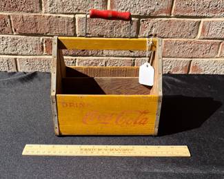 A85 - $55. Coca-Cola wood carrying case. Measures 8.25“ x 5.25”