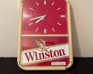 A132 - $35. 1990s Winston Wall clock. Works perfectly. Measures 14" x 20" tall.