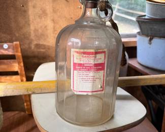 A229 - $30. 1 Gallon Glass Gasoline Bottle with wooden cork.