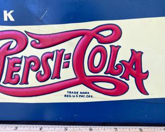 A16 - $75. Pepsi-Cola drink five cent metal sign. Measures 22“ x 5.25“. This sign has a few small scratches. Otherwise in good, vintage shape.