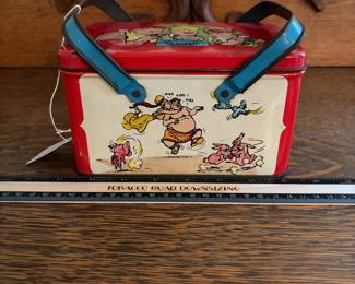 A228 - $20. Joe Palooka lunch kit. Measures 7“ x 5“ 4 inches tall. Has paint wear and scratches on the inside. Overall good, used shape.