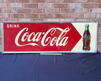 A24 - $700. Coca-Cola Robertson metal 1940s-1950s sign. Measures 54” x 18”.