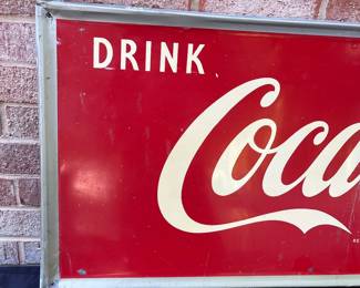 A24 - $700. Coca-Cola Robertson metal 1940s-1950s sign. Measures 54” x 18”.