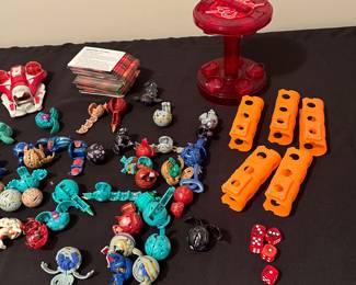 A227 - $150. Bakugan LOT with pieces & a box of cards.