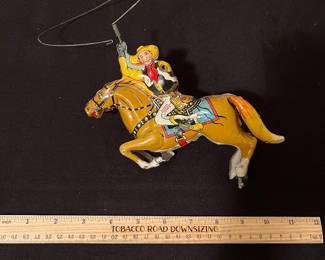 A170 - $50. 1930s MARX 10 wind up cowboy. Missing arm. Not working.