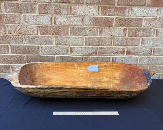 A113 - $95. Primitive Dough Bowl w/ old repair. Measures 33 1/2” x 13”.