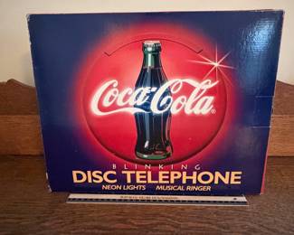 A218 - $40. Coca-Cola disc telephone. Still in box. Brand new.