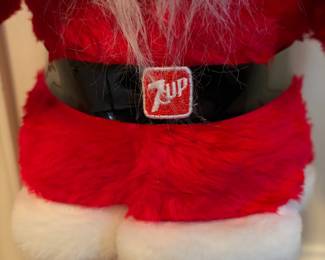 A209 - $100. 1960s Harold Gale Santa 7-Up. Measures 26 inches tall. In good vintage shape.