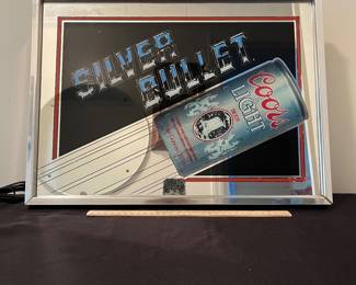 A162 - $25. Coors Silver Bullet lighted sign. Works needs a new bulb. Measures 19.5" x 14.5" tall.