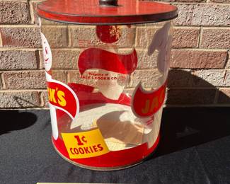 A73 - $65. 1950’s Jack’s 1 cent cookie jar. Measures 12" tall. Plastic with Metal Lid.