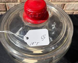 A80 - $55. Tom’s Toasted Peanuts Glass Jar. Measures 10 inches tall. It has some small scratches on the inner rim of the glass.