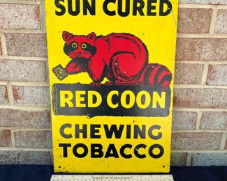 A7 - $40. Vintage Red Coon Chewing Tobacco metal sign. Measures 12” x 18”. Has some small scratches and minimal wear throughout.