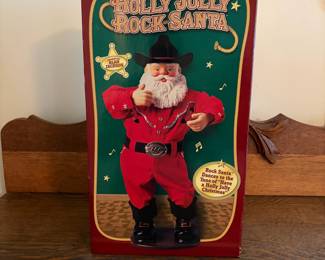 A212 - $25. Holly Jolly Rock Santa in box. Box measures 17 inches tall.