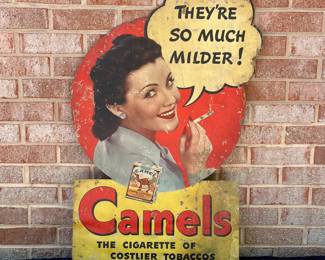 A2 - $225. 1950s Camel Cigarettes counter display die-cut. Measures 33" tall. In fragile condition. Has rips and scrapes throughout. Slightly bowed at the bottom.