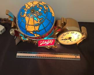 A145 - $165. 1976 Schlitz beer lighted motion globe clock. Like new condition. Works and rotates like it should. Measures 14" x 9.5" tall.