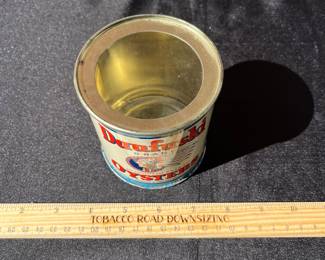 A75 - $30. Dafuski Oysters can. Measures 3.75 inches tall.