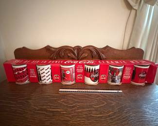 A220 - $20. Set of six ceramic Coca-Cola mugs. Still in package, they look brand new.
