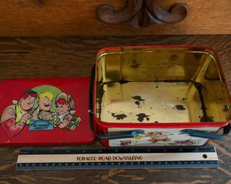 A228 - $20. Joe Palooka lunch kit. Measures 7“ x 5“ 4 inches tall. Has paint wear and scratches on the inside. Overall good, used shape.