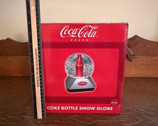A217 - $25. Coke bottle snow globe. Still in box. Box measures 10 inches tall.