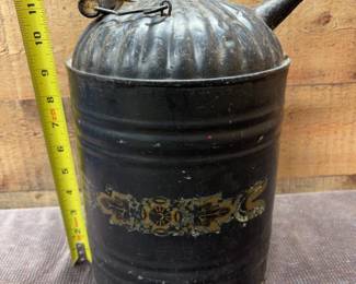 Black metal kerosene jug