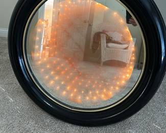 Large thick wall mirror with orange glow lights
